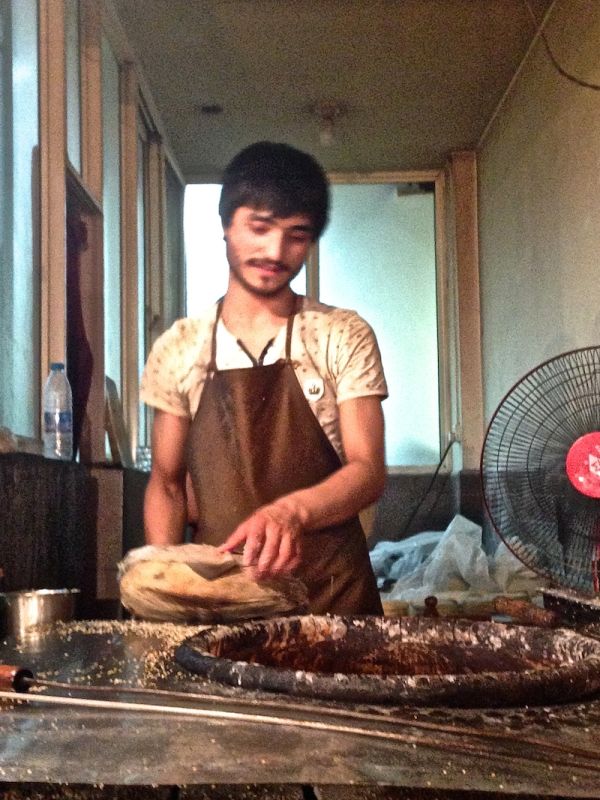 Trying freshly made flat bread in Xi'An's Muslim Quarter