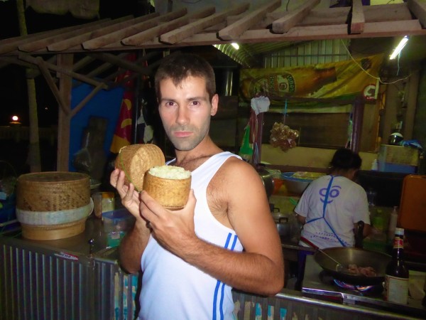 Seb modelling a freshly made bamboo basket of sticky rice in Vientiane