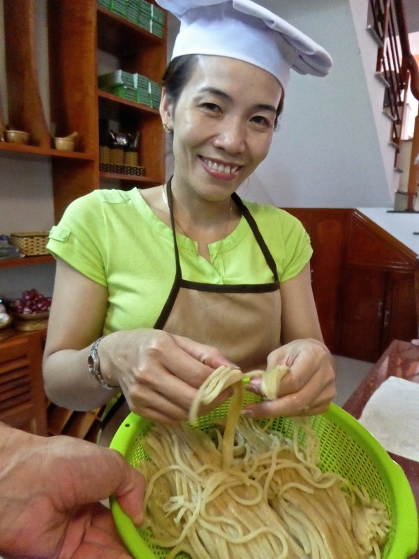 Fresh Cao Lau noodles need to be separated before cooking